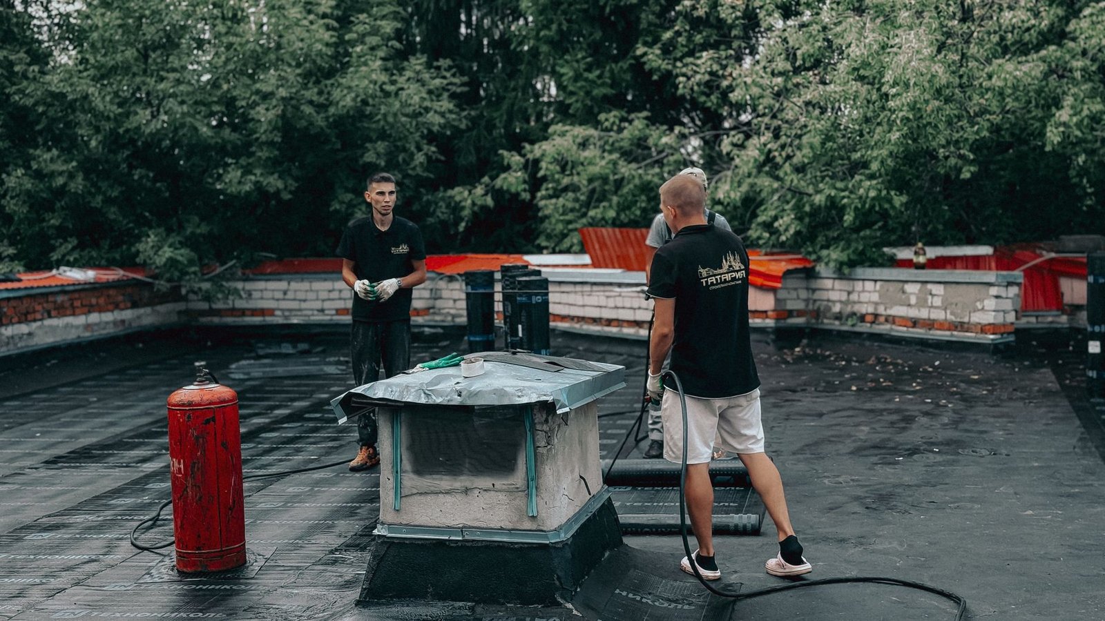 Roofing contractor at work